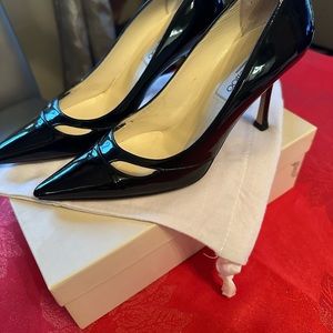 Jimmy Choo size 8.5 black patent with two cutouts.